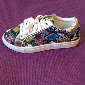Snake print sneakers.